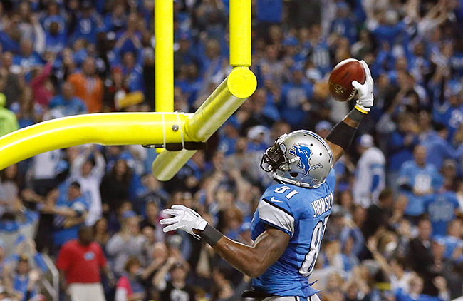 Calvin Johnson festeja luego de atrapar un pase de TD. (AP)